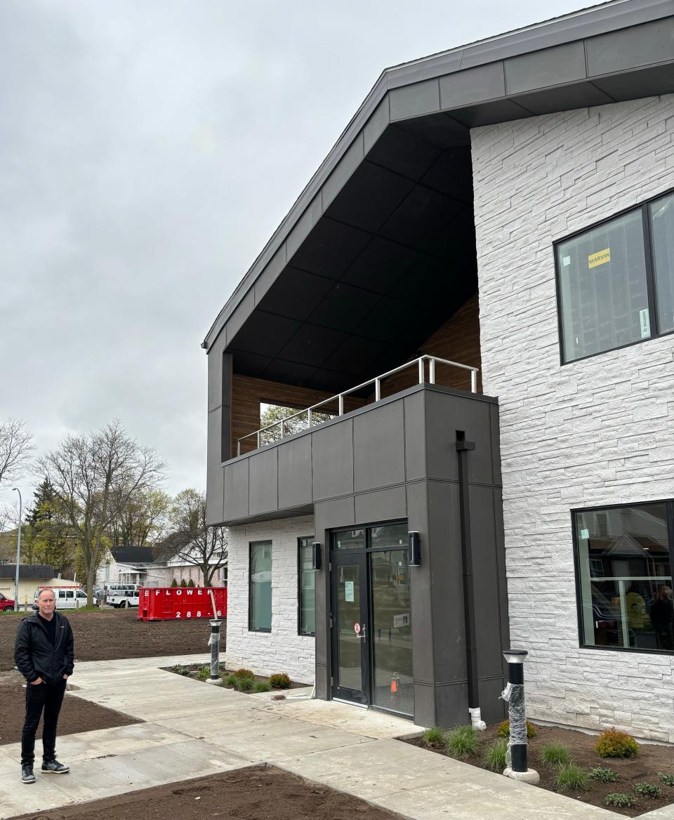 Doug Ackley, Center for Teen Empowerment executive director, stands outside the organization’s new building on Genesee Street on April 24. The building, to be called the Barack and Michelle Obama Teen Empowerment Center, is set to open in June.