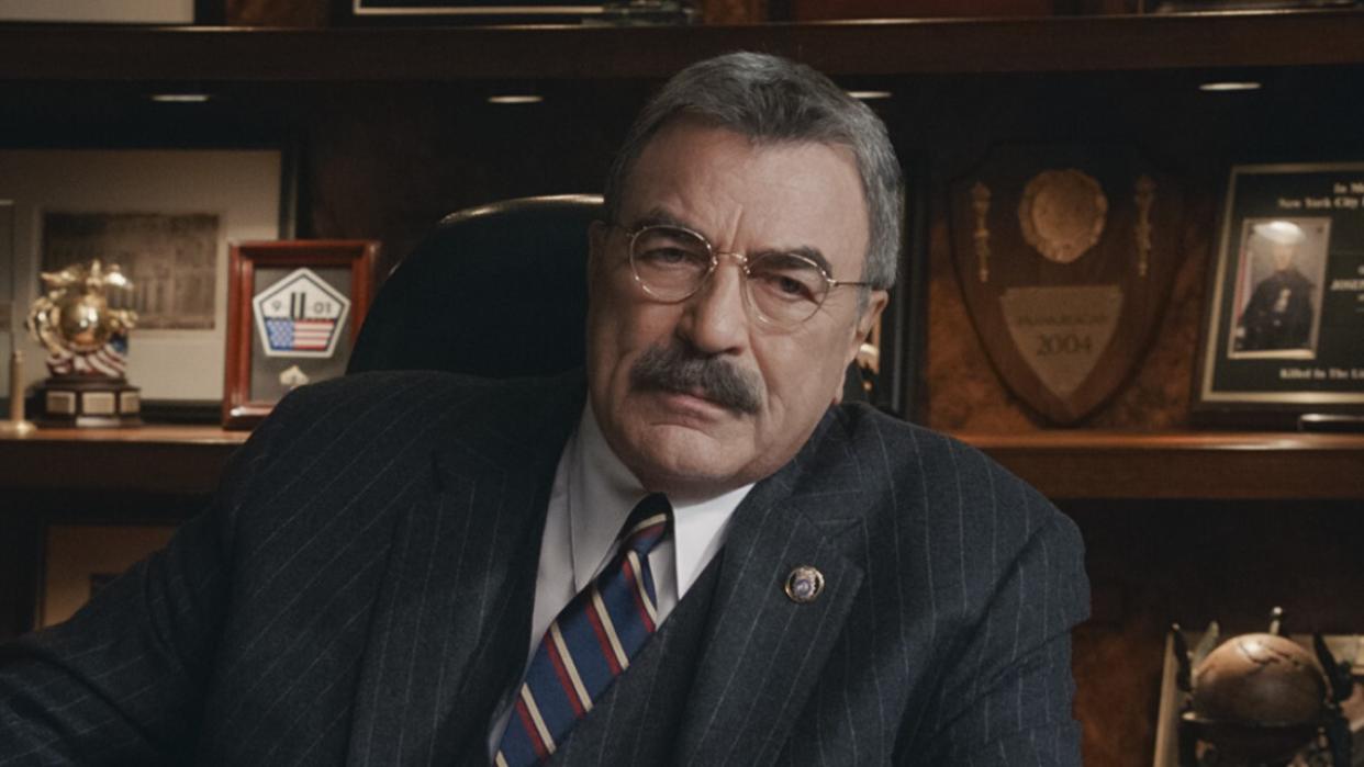  Frank behind office desk in Blue Bloods. 