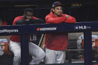 Cleveland Indians' Josh Naylor, right, and Franmil Reyes watch from the dugout after the Indians lost 10-9 to the New York Yankees in Game 2 of an American League wild-card baseball series, early Thursday, Oct. 1, 2020, in Cleveland. (AP Photo/David Dermer)