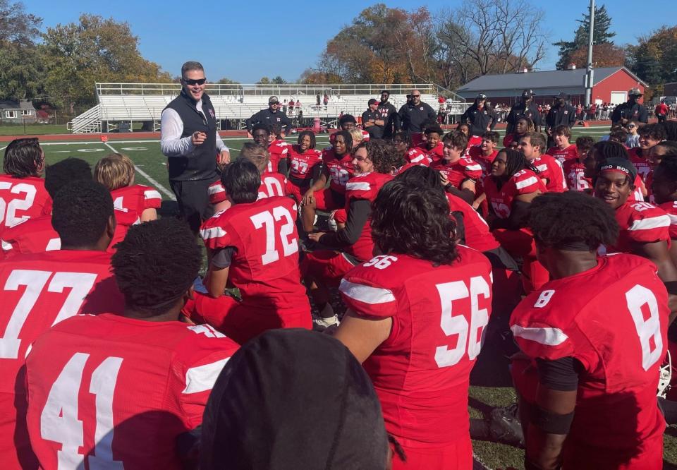 Rancocas Valley football coach Garrett Lucas jokes with his players after getting a water bucket dumped on him following a 13-3 victory over Lenape in the Central Jersey Group 5 quarterfinals on Saturday afternoon.