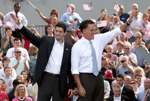 Republican presidential candidate Mitt Romney (right) and his running mate Paul Ryan wave to supporters in Norfolk, Virginia. Romney has unveiled the deficit hawk congressman as his running mate, in a bid to revive his flagging campaign to oust President Barack Obama