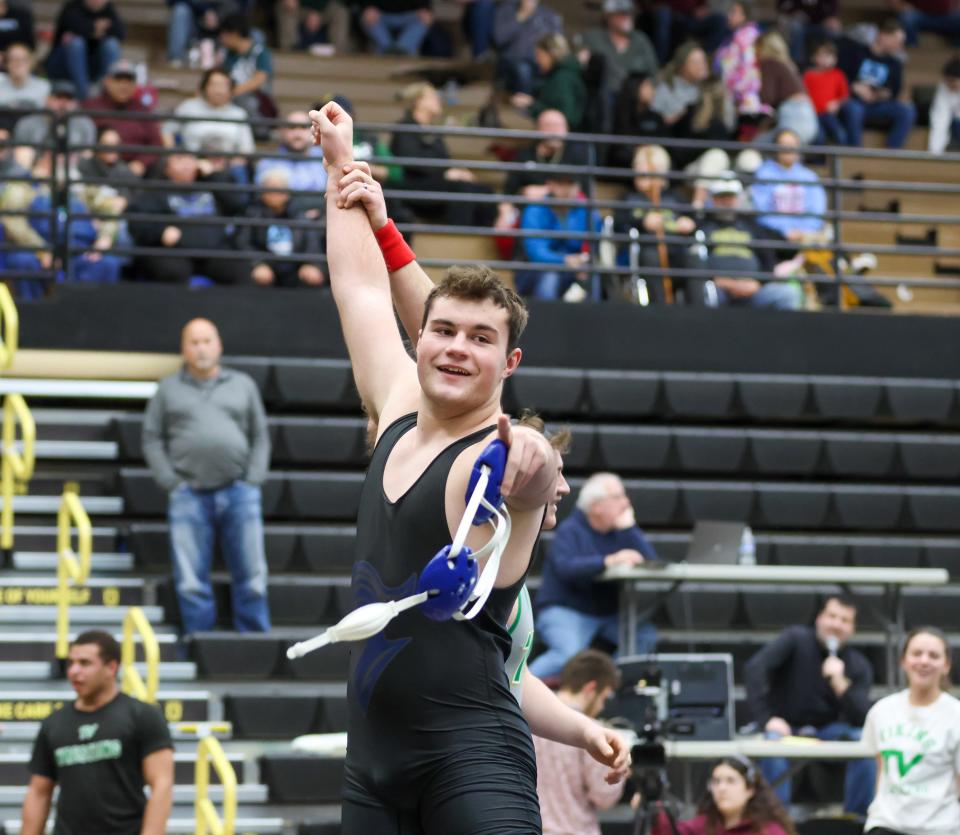 Jonathan Neese of Laville celebrates after winning in the final at 220lbs during the IHSAA Wrestling Regionals Saturday, Feb. 4, 2023 at Penn High School.