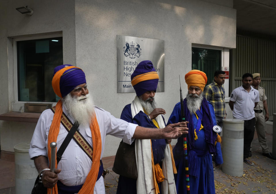 Indian Sikhs protesting against the pulling down of Indian flag from the Indian High Commission building in London gather outside the British High Commission in New Delhi, India, Monday, March 20, 2023. Footage posted on social media showed a man detach the Indian flag from a balcony of the building while a crowd of people below waving bright yellow “Khalistan” banners appeared to encourage him. London’s Metropolitan Police force said a man was arrested on suspicion of violent disorder outside the diplomatic mission on Sunday afternoon. (AP Photo/Manish Swarup)