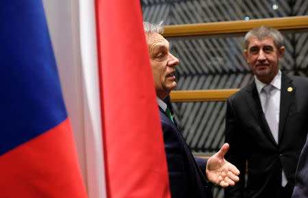 Hungary's Prime Minister Viktor Orban talks with the Czech Republic's Prime Minister Andrej Babis during the Visegrad Group meeting in Brussels, Belgium, December 14, 2017. REUTERS/Olivier Hoslet/Pool