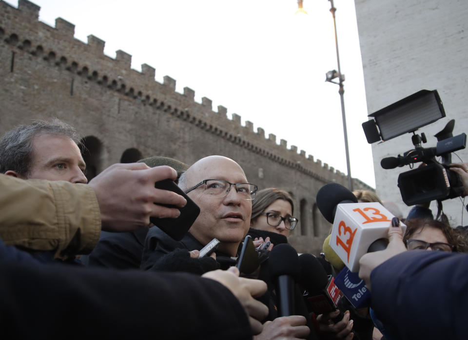 Bishop Fernando Ramos, Secretary General Episcopal Conference of Chile, receives media attention near the Vatican, in Rome Monday, Jan. 14, 2019. A delegation of Chilean bishops has met with Pope Francis a year after he threw his papacy into turmoil by defending a Chilean bishop accused of covering for a notorious sexual predator. (AP Photo/Alessandra Tarantino)