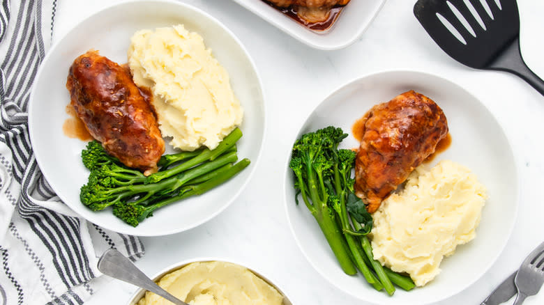 Two bowls of Hunter's chicken with mashed potatoes and broccoli