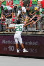 Oregon running back Travis Dye celebrates with fans after their 35-28 win over Ohio State in an NCAA college football game Saturday, Sept. 11, 2021, in Columbus, Ohio. (AP Photo/Jay LaPrete)