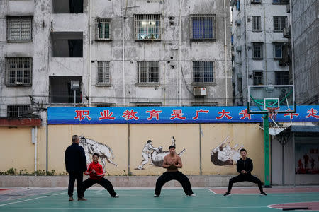 Bullfighters practice martial arts at the Haihua Kung-fu School in Jiaxing, Zhejiang province, China October 27, 2018. REUTERS/Aly Song