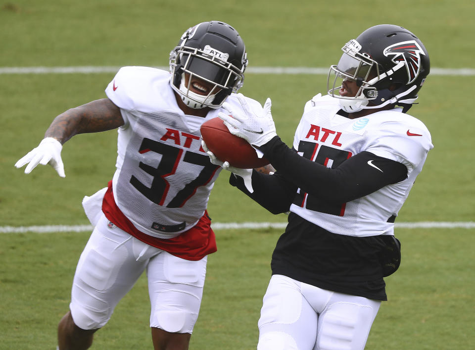 Atlanta Falcons safety Ricardo Allen, left, defends against cornerback Darqueze Dennard, right, during an NFL training camp football practice Saturday, Aug. 22, 2020, in Flowery Branch, Ga. (Curtis Compton/Atlanta Journal-Constitution via AP, Pool)