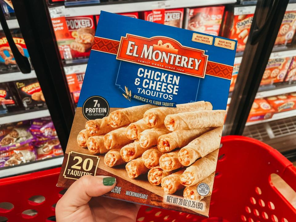 hand holding up a box of el Monterey taquitos at target