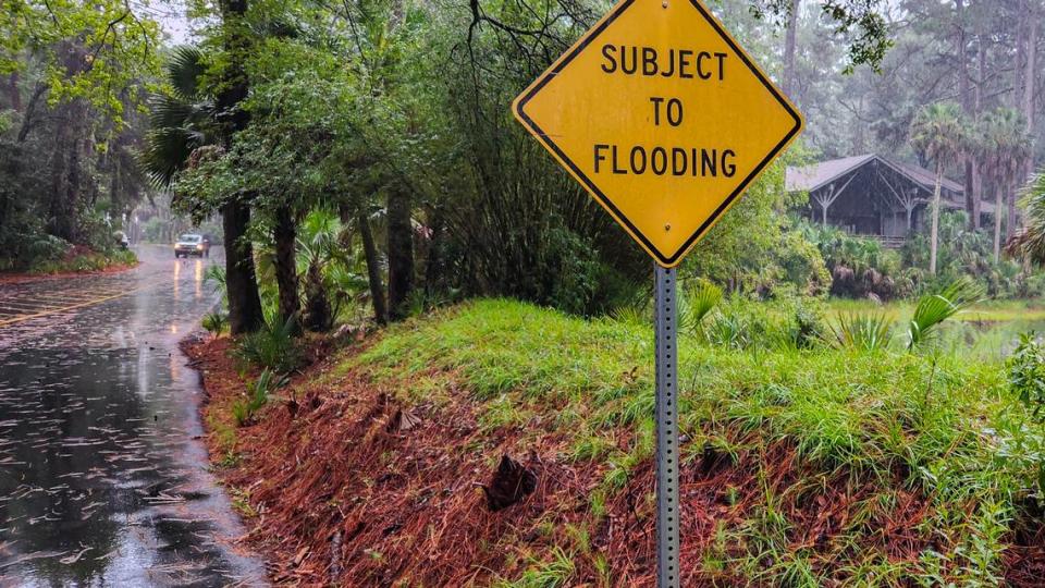 A sign alerts visitors for the potential of flooding upon entering South Carolina’s Hunting Island State Park as seen on Aug. 4, 2023 during an afternoon rainfall.
