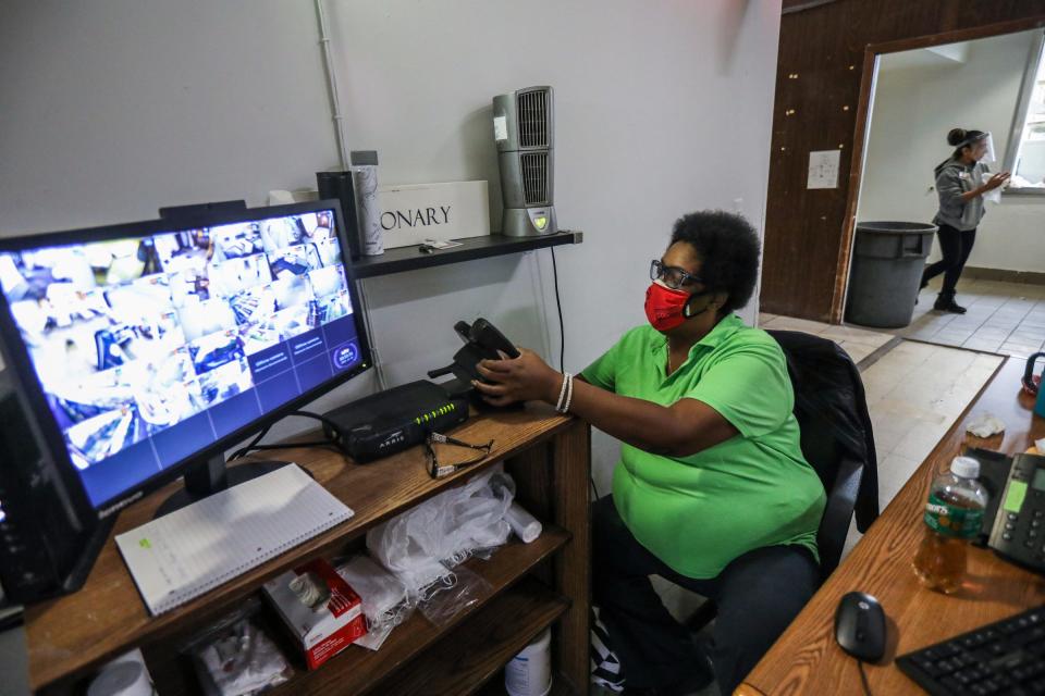 Sherylle Garner, 56, of Detroit, works as the case manager at the Detroit Rescue Mission Ministries' Mack warming center in Detroit on Nov. 12, 2021.