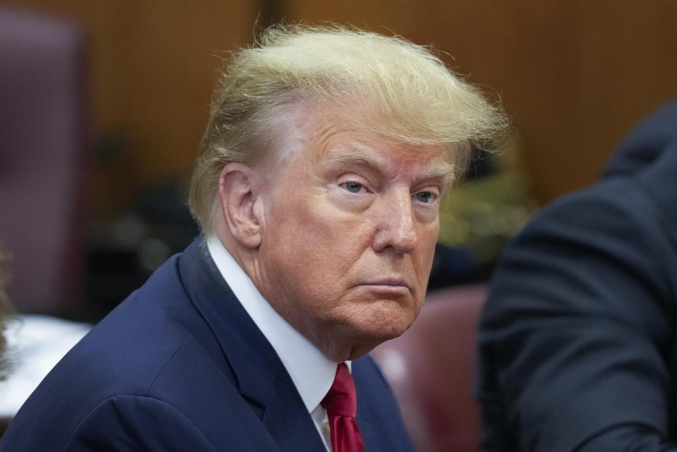 Former President Donald Trump sits at the defense table in a Manhattan court, Tuesday, April 4, 2023, in New York. Trump is appearing in court on charges related to falsifying business records in a hush money investigation, the first president ever to be charged with a crime. (AP Photo/Seth Wenig, Pool)