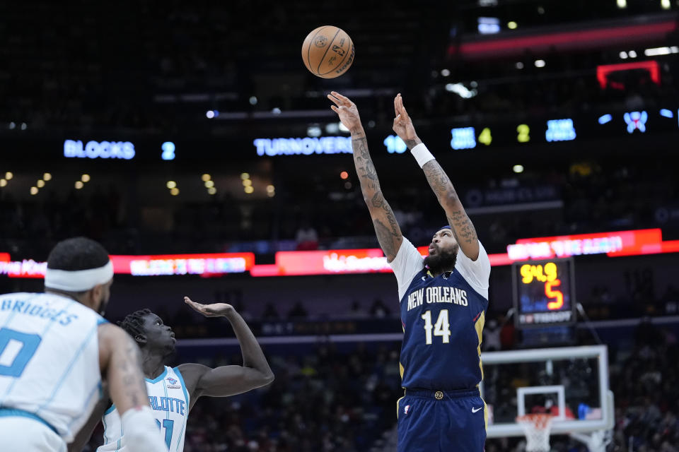 New Orleans Pelicans forward Brandon Ingram (14) shoots a 3-point shot in the second half of an NBA basketball game against the Charlotte Hornets in New Orleans, Wednesday, Jan. 17, 2024. The Pelicans won 132-112. (AP Photo/Gerald Herbert)