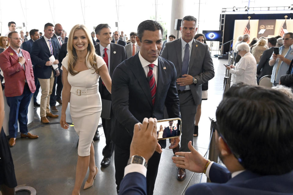 FILE - Miami Mayor Francis Suarez, center, greets supporters after speaking at the "Time for Choosing" series at the Ronald Reagan Presidential Library Thursday, June 15, 2023, in Simi Valley, Calif. (AP Photo/Michael Owen Baker, File)