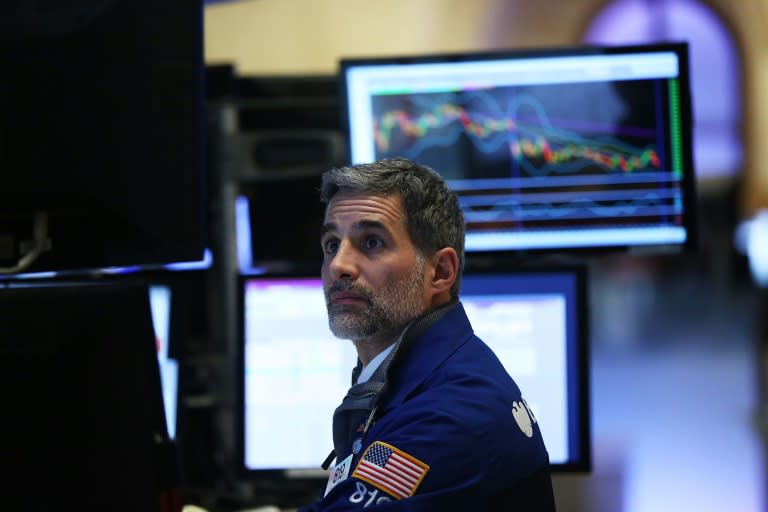 Traders work on the floor of the New York Stock Exchange on February 5, 2016