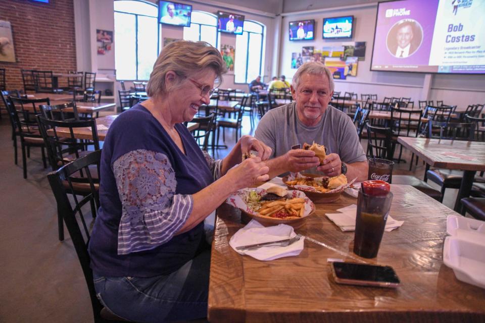 Stringer residents Shari and David Mosley enjoy lunch at Mugshots Bar & Grill as dine-in services resume at restaurants in Hattiesburg, Miss., Monday, May 18, 2020.