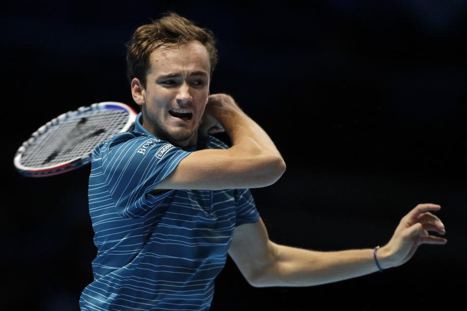 FILE - In this Nov. 11, 2019, file photo, Daniil Medvedev, of Russia, plays a return to Stefanos Tsitsipas, of Greece, during their ATP World Tour Finals singles tennis match at the O2 Arena in London. Tsitsipas will compete in the Australian Open tennis tournament beginning Monday, Jan. 20, 2022. (AP Photo/Kirsty Wigglesworth)