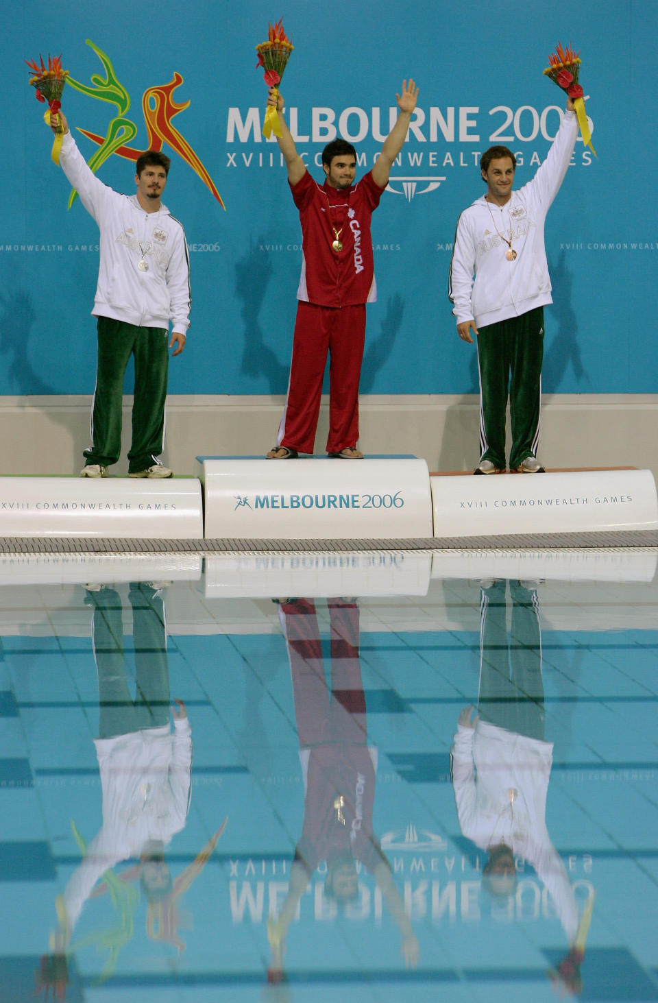 MELBOURNE, AUSTRALIA - MARCH 23: (L to R) Robert Newbery (Silver) of Australia, Alexandre Despatie (Gold) of Canada and Steven Barnett (Bronze) of Australia proudly display the medals won during the Men's 3m Springboard Final during the diving at the Melbourne Sports & Aquatic Centre during day eight of the Melbourne 2006 Commonwealth Games on March 23, 2006 in Melbourne, Australia. (Photo by Mike Hewitt/Getty Images)