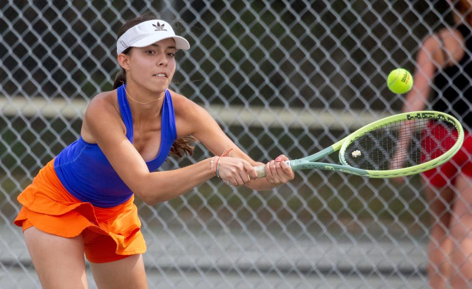 Bartow freshman Montserrat Vasconez reaches for a backhand against Dade City Pasco's Kasey Lang during their No. 1 singles match in the Class 3A regional semifinals in Bartow.