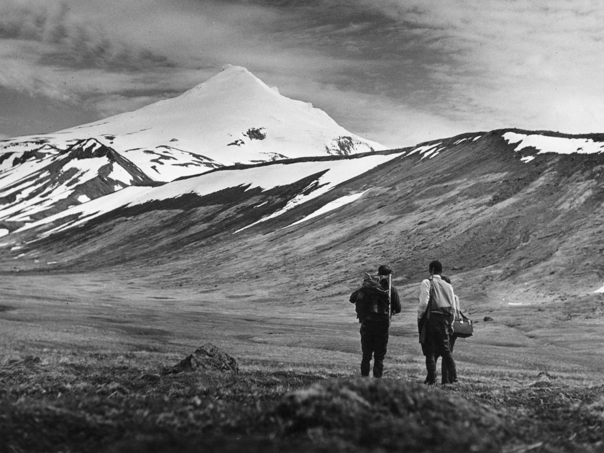 circa 1950: A typical scene of the Aleutian Islands with a volcanic cone in the background