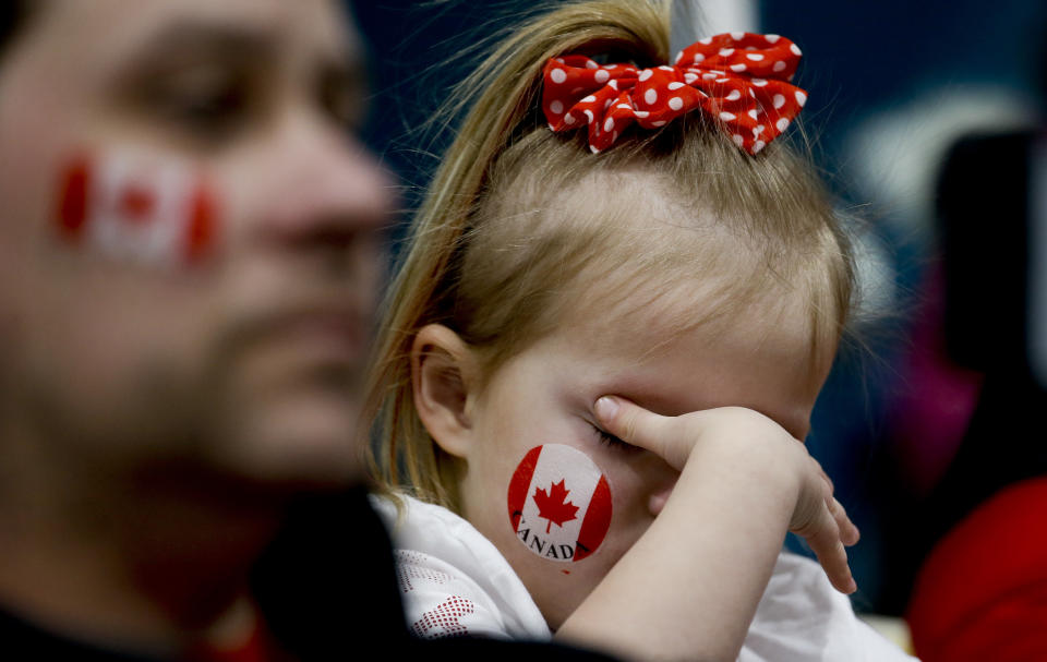 <p>A Canadian fan covers her eyes during the Men’s Curling Match for the bronze medal between Canada and Switzerland at the PyeongChang 2018 Winter Olympics in South Korea, Feb. 23, 2018.<br> (AP Photo/Natacha Pisarenko) </p>
