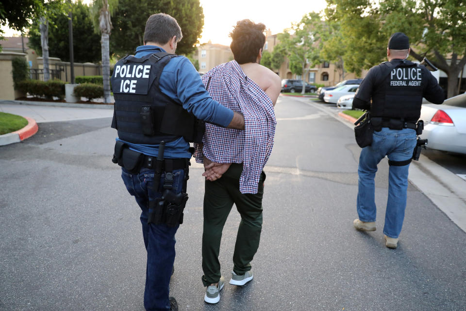 U.S. Immigration and Customs Enforcement (ICE) Assistant Field Office Director Jorge Field, 53, left, arrests an Iranian immigrant in San Clemente, Calif., in May 2017. (Photo: Lucy Nicholson/Reuters)