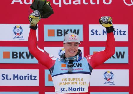 Alpine Skiing - FIS Alpine Skiing World Championships - Men's Super G - St. Moritz, Switzerland - 8/02/17 - Gold medalist Erik Guay of Canada celebrates during the flower presentation. REUTERS/Denis Balibouse