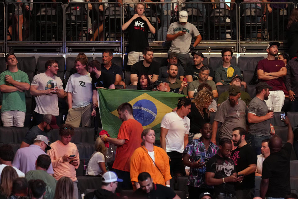 May 13, 2023; Charlotte, North Carolina, USA; Fans display a Brazilian flag during a heavyweight bout between Jairzinho Rozenstruik and Jailton Almeida during UFC Fight Night at Spectrum Center. Mandatory Credit: Jim Dedmon-USA TODAY Sports