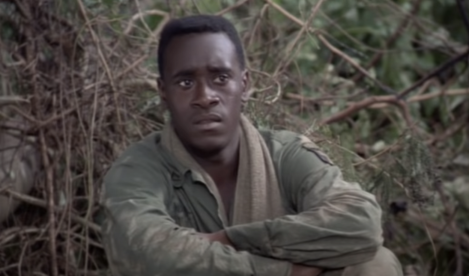 closeup of don sitting on the ground in a uniform