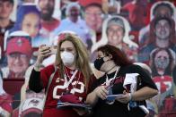 Tampa Bay Buccaneers fans take photos before the NFL Super Bowl 55 football game between the Kansas City Chiefs and Tampa Bay Buccaneers, Sunday, Feb. 7, 2021, in Tampa, Fla. (AP Photo/Ashley Landis)