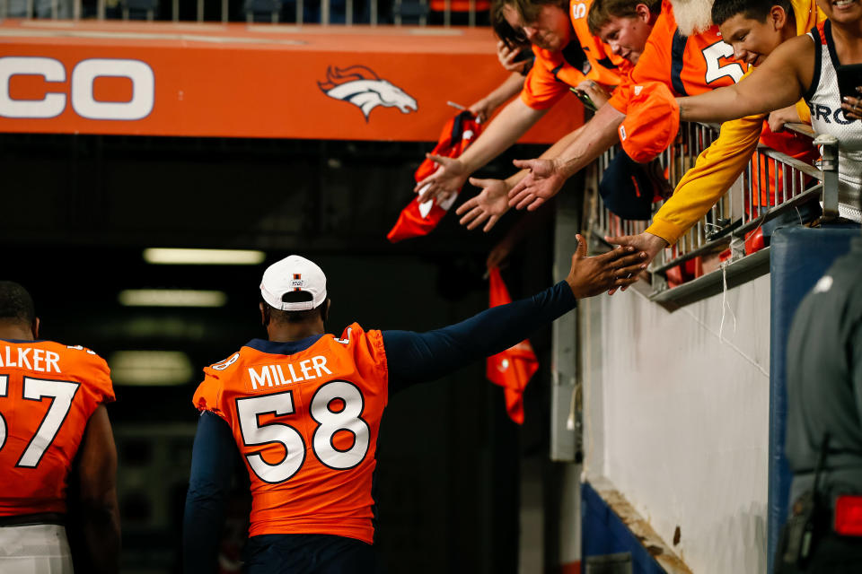 Aug 29, 2019; Denver, CO, USA; Denver Broncos linebacker Von Miller (58) hi-fives fans as he leaves the field after the game against the Arizona Cardinals at Broncos Stadium at Mile High. Mandatory Credit: Isaiah J. Downing-USA TODAY Sports