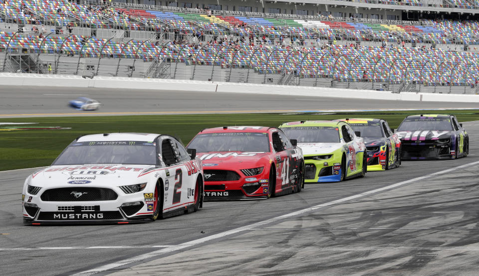 NASCAR drivers, from left, Brad Keselowski (2), Daniel Suarez (41), Tyler Reddick, William Byron and Jimmie Johnson wait on pit road for their turn on the track during auto racing practice for the Daytona 500 at Daytona International Speedway, Saturday, Feb. 16, 2019, in Daytona Beach, Fla. (AP Photo/John Raoux)