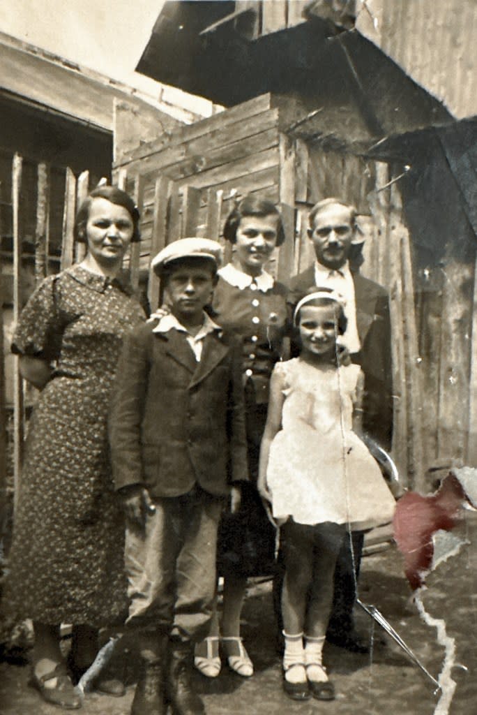 Mira Blumenstock with her parents and older siblings. Only Mira (in white) would survive the war. Courtesy of Rachelle Unreich