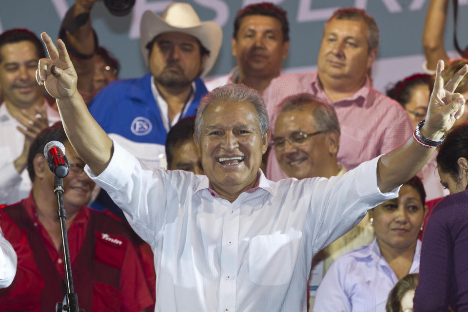 Presidential candidate Salvador Sanchez Ceren, of the ruling Farabundo Marti National Liberation Front (FMLN), celebrates after partial results were announced by election authorities in San Salvador, El Salvador, Sunday, March 9, 2014. El Salvador's too-close-to-call presidential runoff election has raised competing claims of victory from Ceren, a former fighter for leftist guerrillas and the candidate of the once long-ruling conservative party that fought a civil war from 1980 to 1992, Norman Quijano but preliminary returns from nearly all polling stations showed Quijano a few thousands votes behind Ceren. (AP Photo/Esteban Felix)