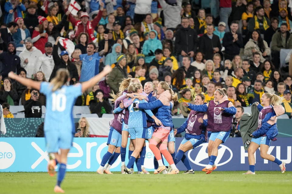 England players celebrate after England's Alessia Russo scored her side's third goal during the Women's World Cup semifinal soccer match between Australia and England at Stadium Australia in Sydney, Australia, Wednesday, Aug. 16, 2023. (AP Photo/Alessandra Tarantino)