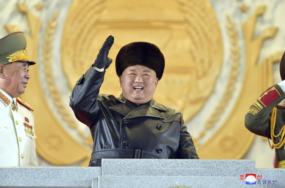 In this photo provided by the North Korean government, North Korean leader Kim Jong Un waves as Kim attended a military parade, marking the ruling party congress, at Kim Il Sung Square in Pyongyang, North Korea Thursday, Jan. 14, 2021. Independent journalists were not given access to cover the event depicted in this image distributed by the North Korean government. The content of this image is as provided and cannot be independently verified. Korean language watermark on image as provided by source reads: "KCNA" which is the abbreviation for Korean Central News Agency. (Korean Central News Agency/Korea News Service via AP)