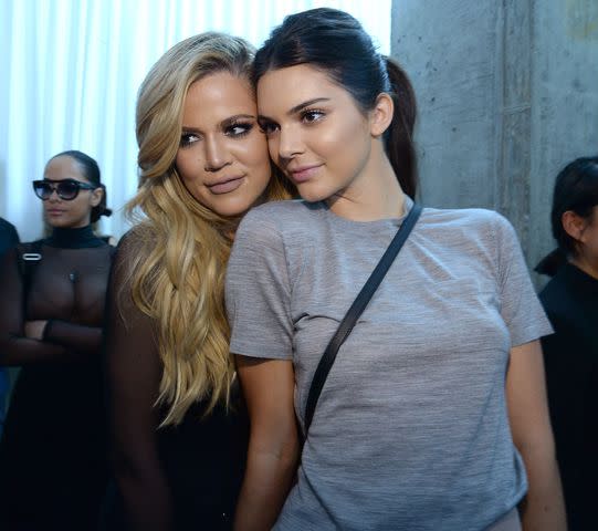 <p>Kevin Mazur/Getty</p> Khloé Kardashian (left) and Kendall Jenner (right)