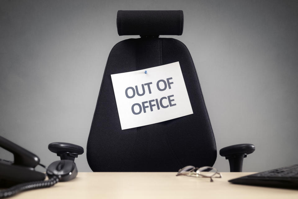 An "Out of office" sign on a chair