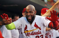 St. Louis Cardinals' Marcell Ozuna is congratulated by teammates after hitting a solo home run during the second inning of the team's baseball game against the Washington Nationals on Wednesday, Aug. 15, 2018, in St. Louis. (AP Photo/Jeff Roberson)