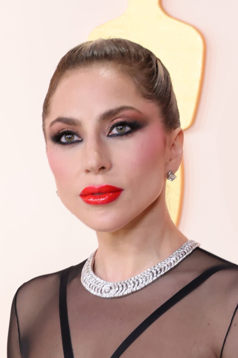 lady gaga with a red lipstick 50s makeup look