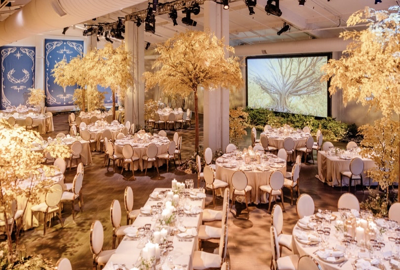 A dining room decorated with various trees and tables