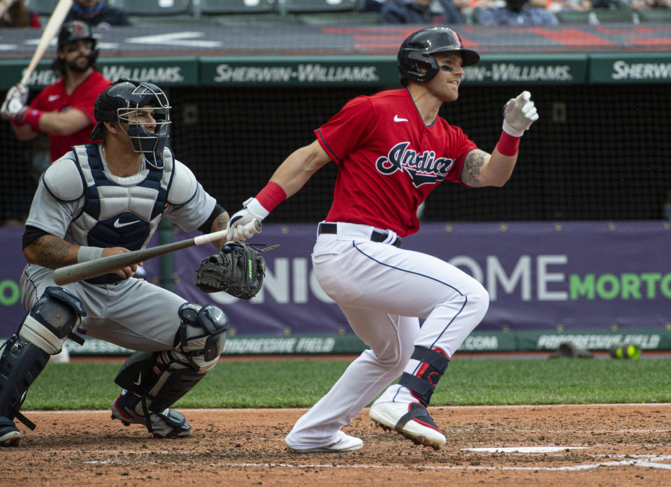 Cleveland Indians' Jake Bauers watches his RBI fielders choice off Detroit Tigers starting pitcher Jose Urena as Tigers catcher Wilson Ramos looks on during the second inning of a baseball game in Cleveland, Sunday, April 11, 2021. (AP Photo/Phil Long)