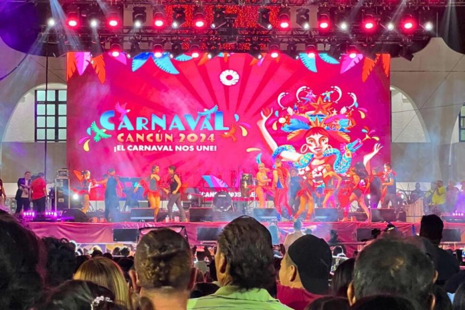 tulum vs cancun Pictured: Cancun Carnaval stage with performers and crowd of people watching