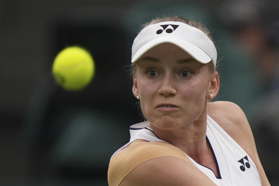 Kazakhstan's Elena Rybakina plays a return to Shelby Rogers of the US during the first round women's singles match on day two of the Wimbledon tennis championships in London, Tuesday, July 4, 2023. (AP Photo/Alberto Pezzali)