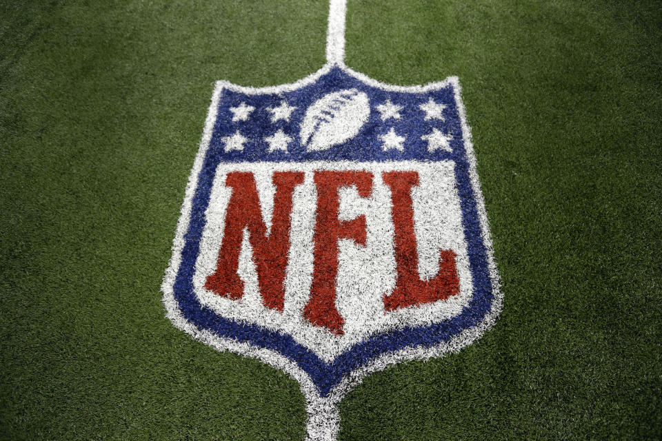 FILE - An NFL logo on the field after a football game between the Washington Redskins and Dallas Cowboys Sunday, Oct. 13, 2013, in Arlington, Texas. The NFL is making additional moves to reach more fans with direct-to-consumer offerings. The league announced on Wednesday, Aug. 9, 2023, that NFL Network and NFL RedZone will be available on “NFL+,” the streaming service the league launched last year. According to Nielsen’s cable estimates, NFL Network is available to 51.1 million customers, which is the most for a network run by a professional league or college conference.(AP Photo/LM Otero, File)