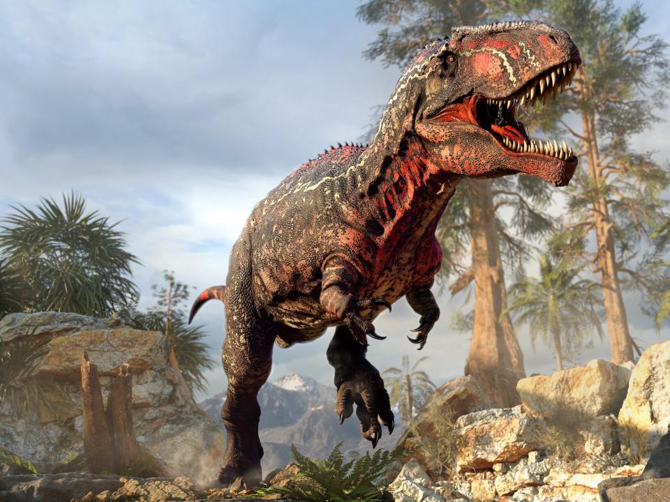 a 3D rendering shows an artist's impression of a colorful gigantosaurus running in the jungle.