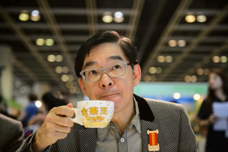 A competition judge samples some milk tea during judging in the Hong Kong Style Milk Tea international final held during the 2016 Hong Kong International Tea Fair on August 13, 2016