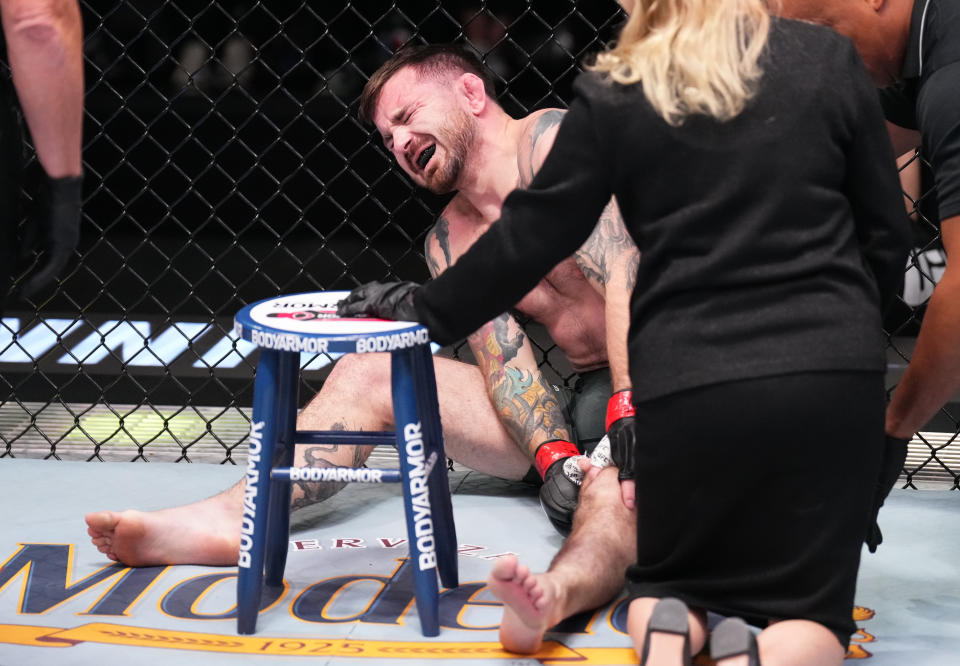 LAS VEGAS, NEVADA - NOVEMBER 05: Darrick Minner reacts after suffering an apparent injury against Shayilan Nuerdanbieke of China in a featherweight fight during the UFC Fight Night event at UFC APEX on November 05, 2022 in Las Vegas, Nevada. (Photo by Chris Unger/Zuffa LLC)