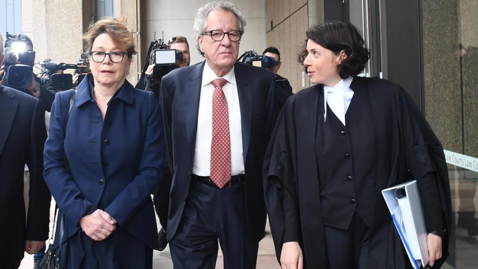 Geoffrey Rush (centre) will be awarded an initial $850,000 in damages. Source: AAP